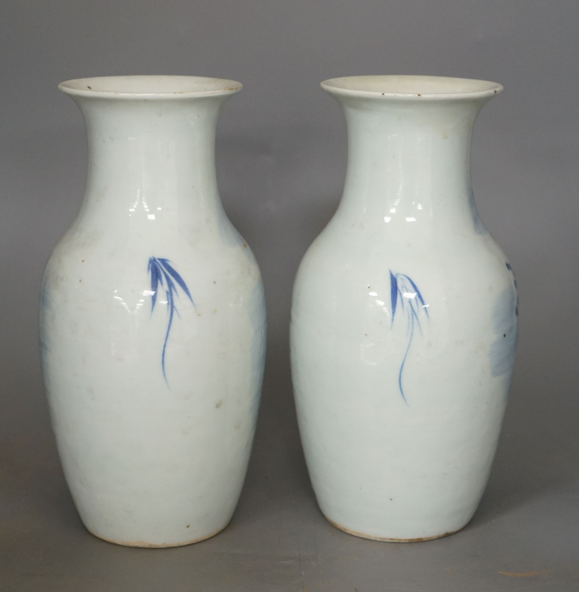 A pair of 19th century Chinese blue and white three friends of winter vases 22cm